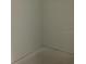 A minimalist corner with neutral-colored walls and a concrete floor at 5733 Haystack Drive, St Cloud, FL 34771