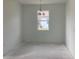 Bright dining room featuring new light fixture, neutral paint, and large window at 5733 Haystack Drive, St Cloud, FL 34771