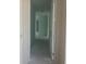 Bright hallway with white walls, showcasing the layout and flow of the home at 5733 Haystack Drive, St Cloud, FL 34771