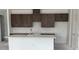 This open kitchen features a large center island, sleek countertops, and stainless steel appliances at 5733 Haystack Drive, St Cloud, FL 34771