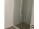 Contemporary shower featuring glass door and grey tiled walls for modern appeal at 5733 Haystack Drive, St Cloud, FL 34771