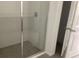 Modern shower with glass door and gray tiled walls, providing a sleek design at 5733 Haystack Drive, St Cloud, FL 34771
