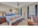 Cozy bedroom with large windows, ceiling fan, and comfortable furnishings creates a relaxing atmosphere at 611 Campus St # 160, Celebration, FL 34747