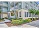 Charming building exterior with balconies overlooking landscaped grounds and sidewalks at 611 Campus St # 160, Celebration, FL 34747