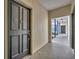Hallway view with entryway door to unit, offering secured access and welcoming space at 611 Campus St # 160, Celebration, FL 34747