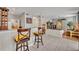 Bright open living area with breakfast bar, tile floors, and neutral color scheme at 611 Campus St # 160, Celebration, FL 34747