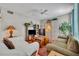 Comfortable living room featuring tile flooring, neutral paint, and easy access to kitchen/dining areas at 611 Campus St # 160, Celebration, FL 34747