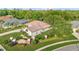 Aerial view of a home in a well-maintained community with lush greenery and manicured lawns at 6121 Oxbow Bend Ln, Port Orange, FL 32128