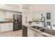 Spacious kitchen boasts granite countertops, stainless steel appliances, and ample cabinet space at 6121 Oxbow Bend Ln, Port Orange, FL 32128