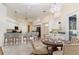 Open kitchen and dining area featuring granite countertops, stainless appliances, and bright lighting at 6121 Oxbow Bend Ln, Port Orange, FL 32128