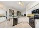 Modern kitchen with granite countertops, stainless steel appliances, and a breakfast bar for casual dining at 6121 Oxbow Bend Ln, Port Orange, FL 32128