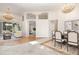 Open floor plan features spacious living room, dining area, and high ceilings with elegant chandeliers at 6121 Oxbow Bend Ln, Port Orange, FL 32128