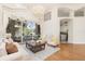 Bright living room features elegant furniture, a decorative rug, and expansive sliding doors to the patio at 6121 Oxbow Bend Ln, Port Orange, FL 32128