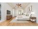 Cozy main bedroom featuring tray ceiling, neutral decor, and plenty of natural light at 6121 Oxbow Bend Ln, Port Orange, FL 32128