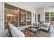 Inviting patio with comfortable seating, chandelier view, and sliding glass doors at 6121 Oxbow Bend Ln, Port Orange, FL 32128
