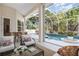 Relaxing screened-in pool area with comfortable seating and lush landscaping at 6121 Oxbow Bend Ln, Port Orange, FL 32128
