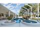 Backyard pool area features multiple seating spots and gorgeous landscaping at 6121 Oxbow Bend Ln, Port Orange, FL 32128