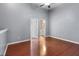 Bright bedroom features hardwood floors and two doorways for easy access to other areas at 6360 Ranelagh Dr # 104, Orlando, FL 32835