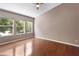 Spacious bedroom filled with natural light, complemented by beautiful hardwood floors at 6360 Ranelagh Dr # 104, Orlando, FL 32835