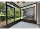 Enclosed patio with a fan and view to the outdoors at 6360 Ranelagh Dr # 104, Orlando, FL 32835