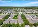 Expansive aerial view showcasing a well-planned community with lush greenery and serene lakes at 7508 Bentonshire Ave, Windermere, FL 34786