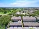 Aerial view of townhomes featuring well-maintained landscaping and community green spaces at 7508 Bentonshire Ave, Windermere, FL 34786
