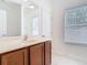 Bathroom featuring a vanity with granite counters, and tile floors at 7508 Bentonshire Ave, Windermere, FL 34786