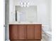 Bathroom with double vanity, large mirror, and tile flooring at 7508 Bentonshire Ave, Windermere, FL 34786