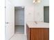 Bathroom featuring vanity and doorway to room with closet at 7508 Bentonshire Ave, Windermere, FL 34786