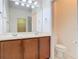 Bathroom vanity with double sinks, tile floors, and access to walk-in closet at 7508 Bentonshire Ave, Windermere, FL 34786