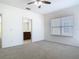 Bright bedroom with ensuite bathroom and neutral carpet at 7508 Bentonshire Ave, Windermere, FL 34786