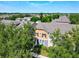 Upper-level view of an inviting home showcasing its architectural details and landscaped surroundings at 7508 Bentonshire Ave, Windermere, FL 34786