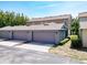 Townhome exterior featuring a three-car garage and well-maintained landscaping at 7508 Bentonshire Ave, Windermere, FL 34786