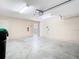 Well-lit two-car garage with high ceilings and access to the backyard at 7508 Bentonshire Ave, Windermere, FL 34786