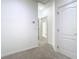 Hallway features neutral carpet and white trim throughout at 7508 Bentonshire Ave, Windermere, FL 34786