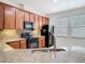 Beautiful kitchen boasting stainless steel appliances, granite counters, and ample cabinet space at 7508 Bentonshire Ave, Windermere, FL 34786