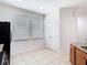 Bright kitchen featuring tile flooring, natural light from two windows, and convenient pantry storage at 7508 Bentonshire Ave, Windermere, FL 34786