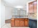 Kitchen features a breakfast bar with wood cabinetry and sink overlooking the living area at 7508 Bentonshire Ave, Windermere, FL 34786