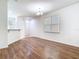 Bright living room showcases hardwood floors, a modern chandelier, and natural light at 7508 Bentonshire Ave, Windermere, FL 34786