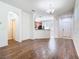 Hardwood floors flow from the living room into the kitchen in this open-concept design at 7508 Bentonshire Ave, Windermere, FL 34786