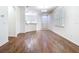 Spacious living room with hardwood floors, natural light, and an open view of the kitchen at 7508 Bentonshire Ave, Windermere, FL 34786