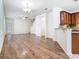 Bright, open-concept living area featuring hardwood floors, modern lighting, and a staircase at 7508 Bentonshire Ave, Windermere, FL 34786