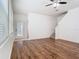 Inviting living room with wood floors and staircase leading to the upper level at 7508 Bentonshire Ave, Windermere, FL 34786