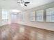 Bright open concept living area featuring wood floors and lots of natural light at 7508 Bentonshire Ave, Windermere, FL 34786