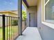 Private patio area enclosed with a black metal fence, offering a cozy outdoor space at 7508 Bentonshire Ave, Windermere, FL 34786