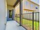 Covered patio with a black metal fence, perfect for outdoor relaxation and privacy at 7508 Bentonshire Ave, Windermere, FL 34786