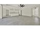 Open concept living room and kitchen area with modern ceiling fan and fixtures at 9241 Eagles Perch Pl, Orlando, FL 32825