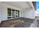 Covered patio features large sliding glass doors offering seamless indoor-outdoor living at 9241 Eagles Perch Pl, Orlando, FL 32825