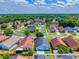 Aerial view of neighborhood, showcasing street layout, landscaping, and nearby green spaces at 3010 Egrets Landing Dr, Lake Mary, FL 32746