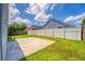 Large backyard featuring lush grass, a white fence, and ample space at 3010 Egrets Landing Dr, Lake Mary, FL 32746